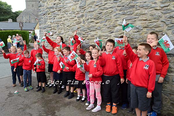 Pupils from the Llanddewi Brefi Campus of Ysgol Henry Richard waving farewell to HRH The Prince of Wales outside The New Inn